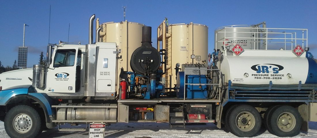J.R.'s hot oiler with burner, tanks and hose reel